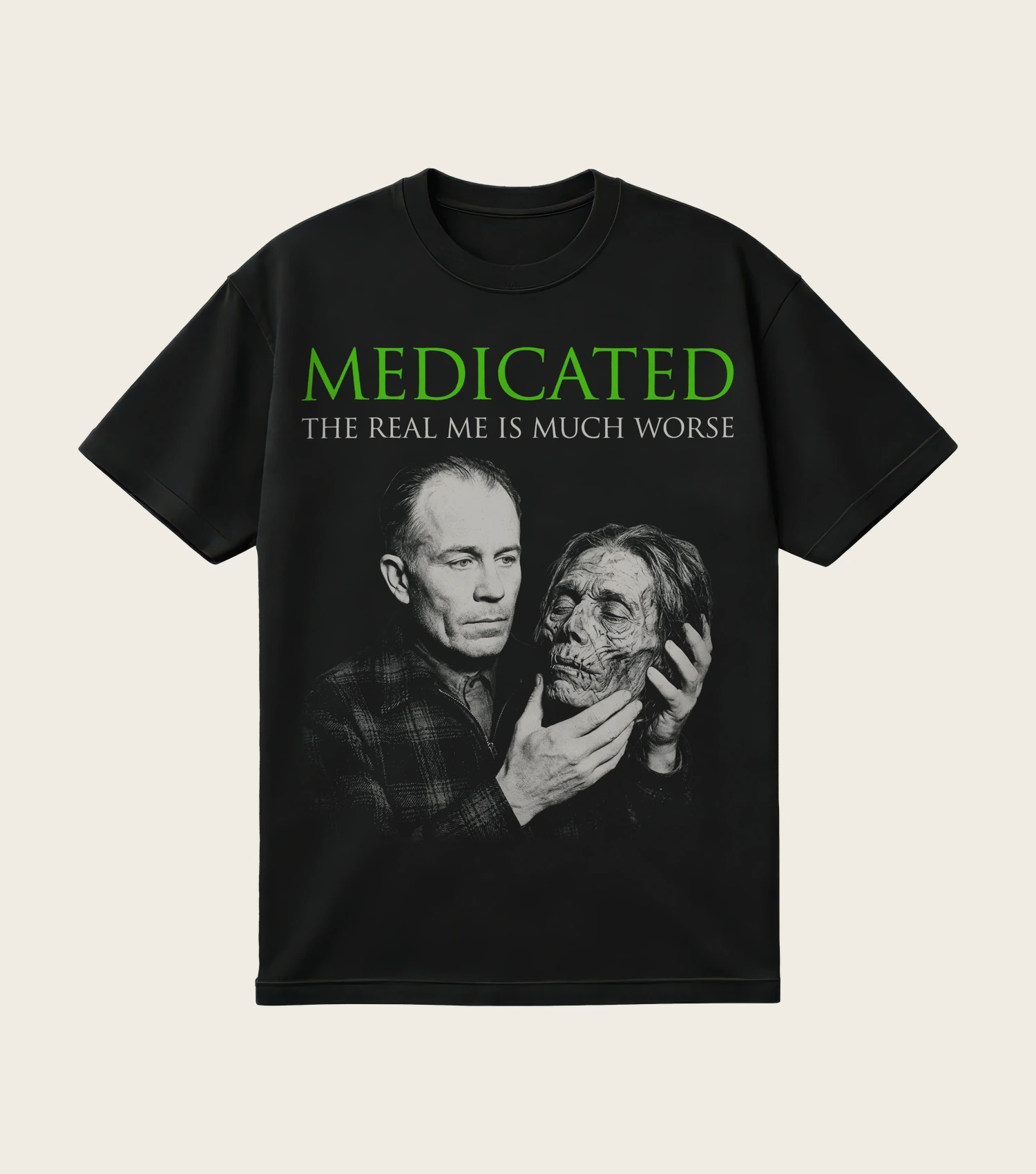 Medicated: The Real Me Is Much Worse printed on a black t-shirt, laid flat