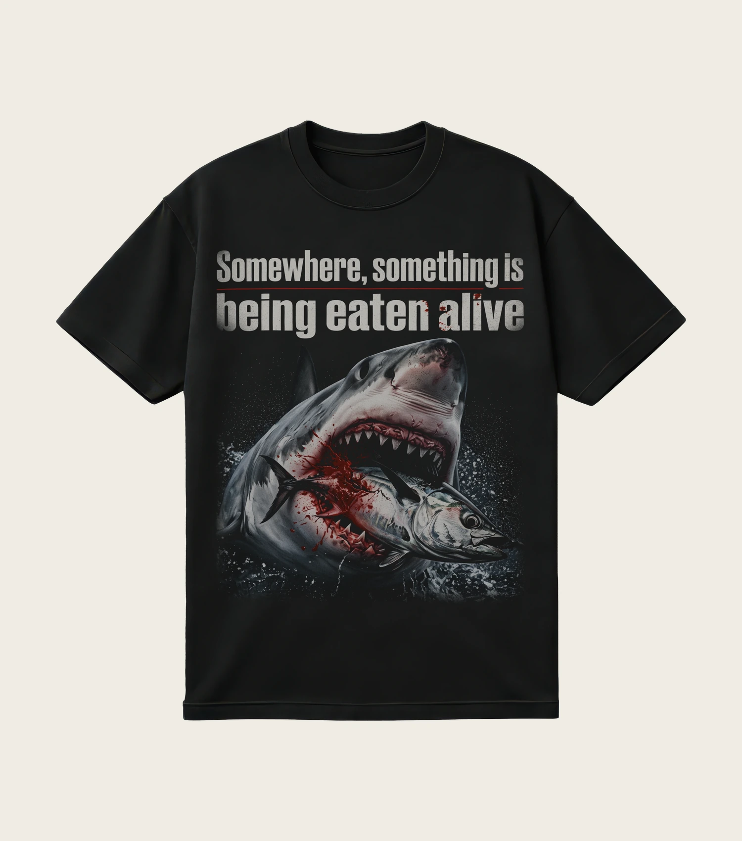 Somewhere, Something Is Being Eaten Alive printed on a black t-shirt, laid flat