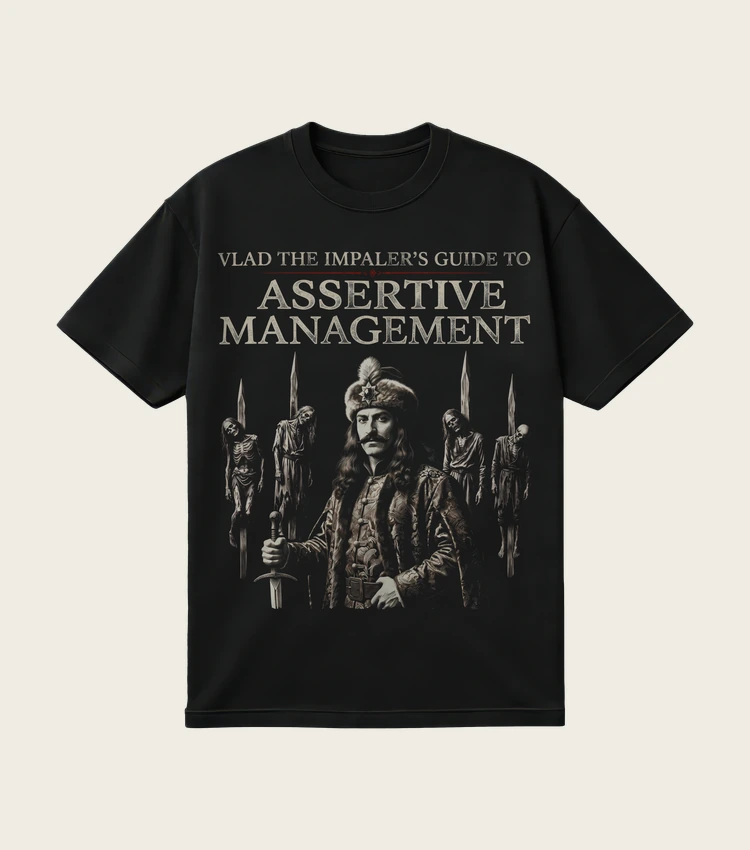Vlad the Impaler's Guide to Assertive Management printed on a black t-shirt, laid flat